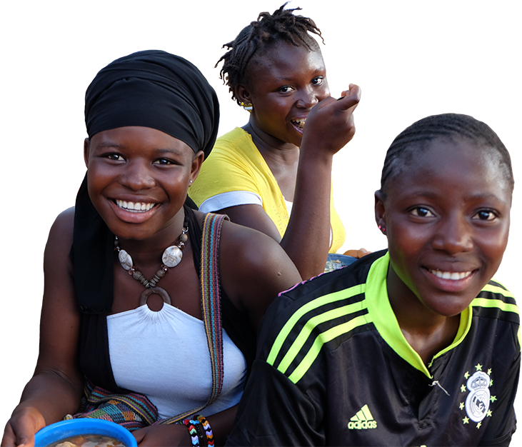 Photo of three adolescent girls at a market in Guinea