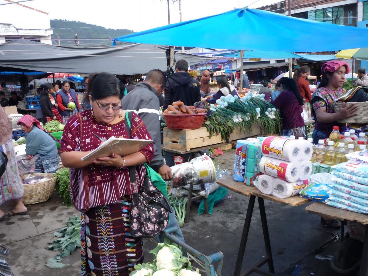 Women checking food at the market