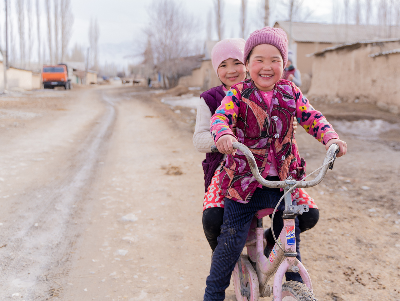 Children in Batken oblast riding a bicycle