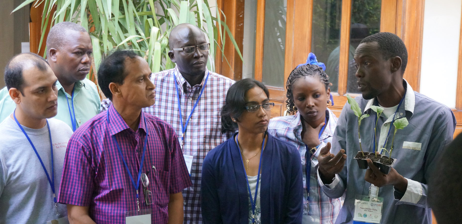 workshop participants learning about pest management in plants