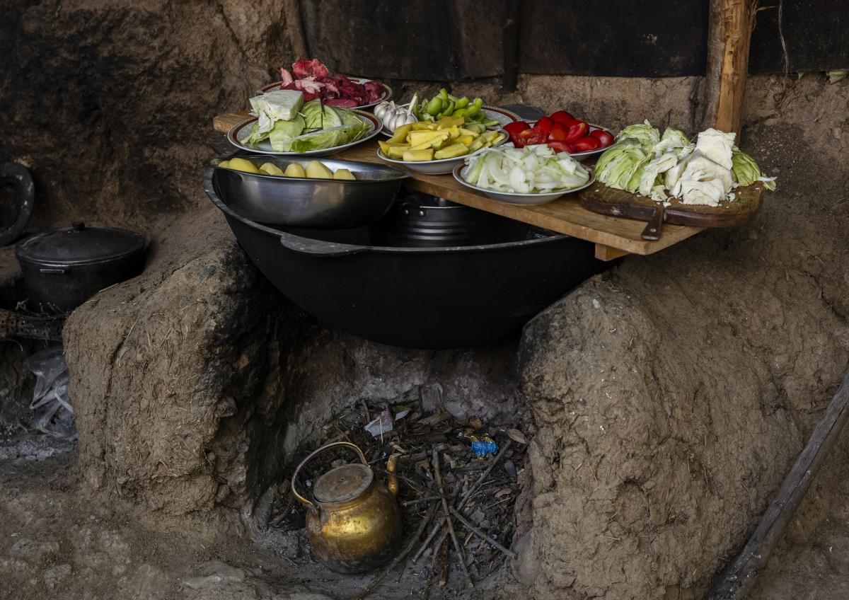 a meal being prepared over a fire