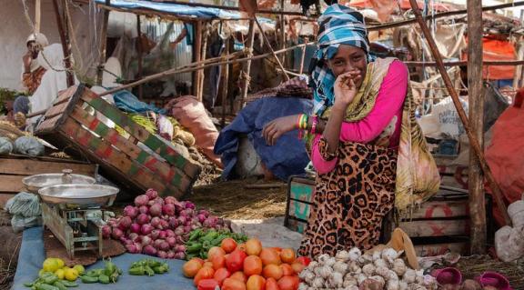Young woman working at a local market in Addis Ababa, Ethiopia.