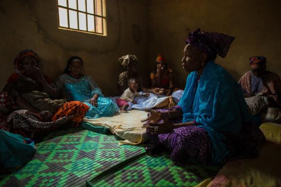 Hapsatou Ka, 37, a community-based solution provider, educates young mothers about nutrition and hygiene best practices.