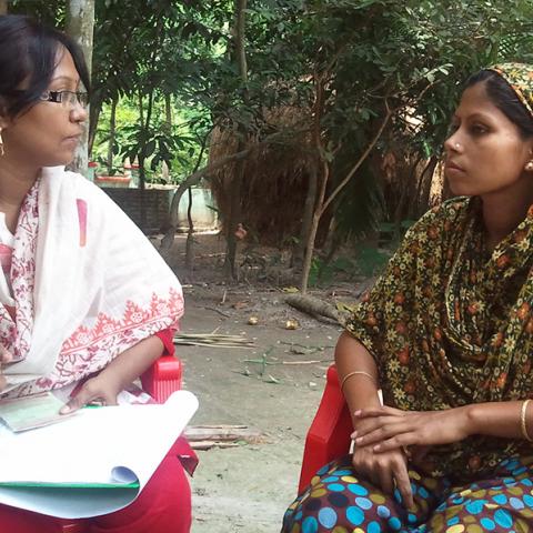 Photo of two women outside in a counseling session