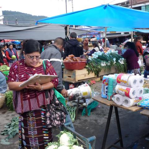 Women checking food at the market