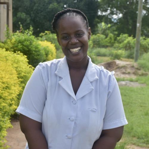 Nurse Isabella Hwinzela Bigendako stands outside the health facility in Tanzania