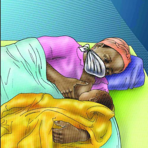 woman nursing baby at night wearing mask to protect from COVID-19 exposure